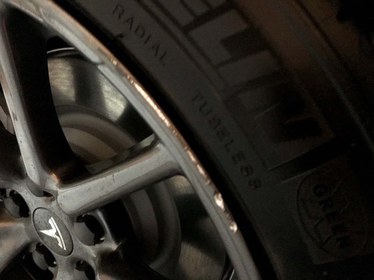 Tesla Model 3 Aero rim curb rash repair after sanding
