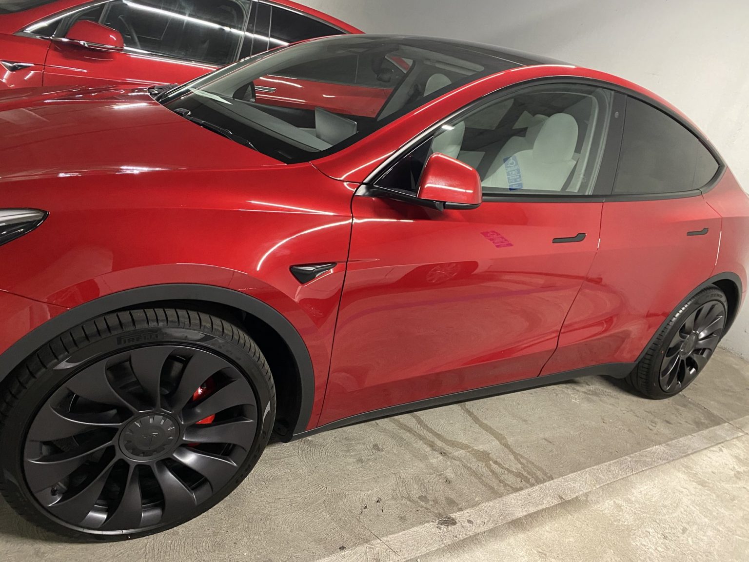 Check out the first red Tesla Model Y's with white interiors delivered