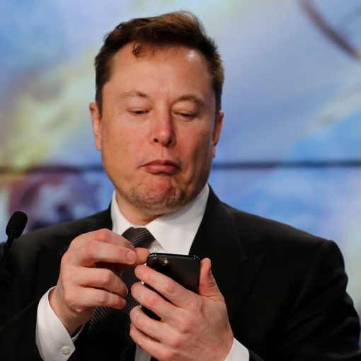Elon Musk on his phone