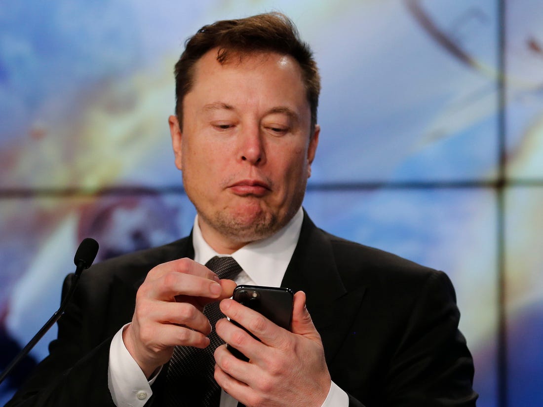 Elon Musk on his phone