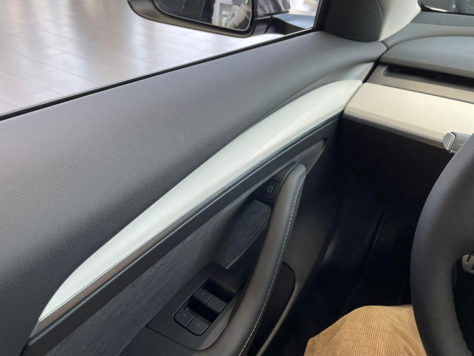 Upclose look at new Tesla Model 3 wood door trim in white Drive Tesla