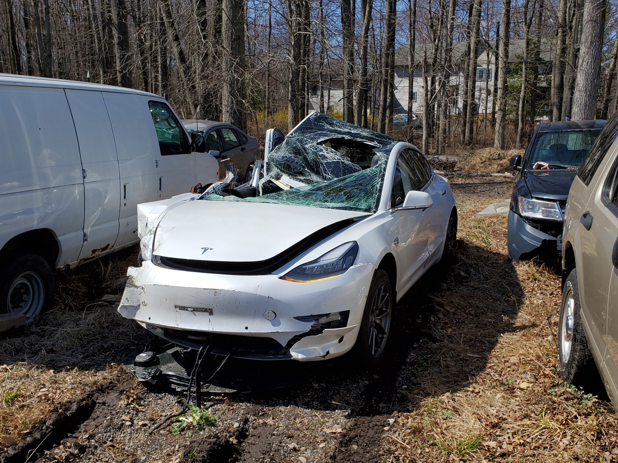 Tesla Model 3 Crashes Into Semi Trailer, Driver Survives Roof Being ...