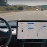 Tesla navigation while driving