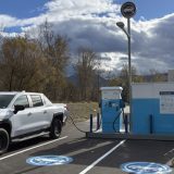 Portable EV charge site installed in a paved parking lot at the