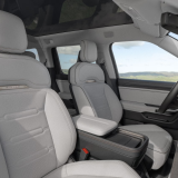 Light grey front seats and dashboard inside the Rivian R2