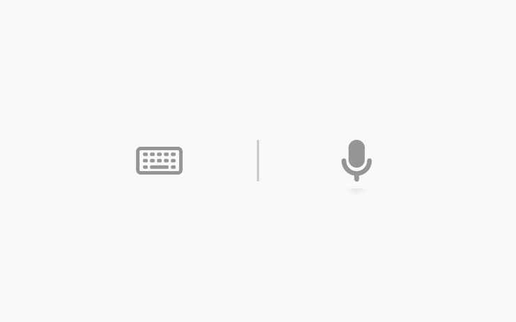 A minimalist interface with a gray keyboard icon on the left, a microphone icon on the right, and a vertical line separating them, on a light gray background.