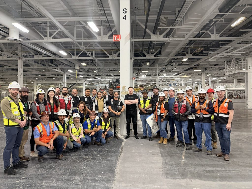 elon walking optimus production line