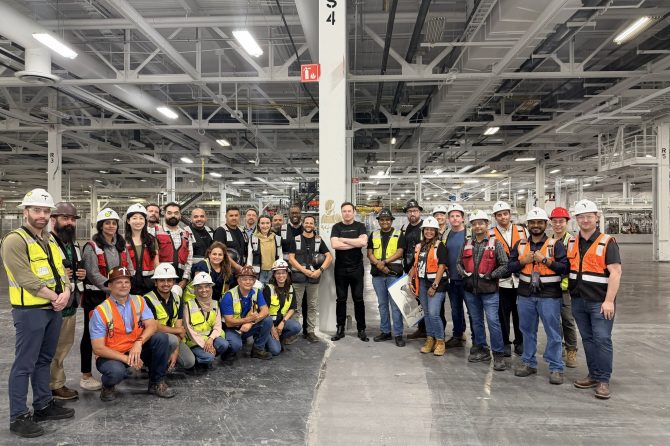 elon walking optimus production line