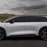 Silver Lucid Gravity GT-S SUV side profile on a coastal clifftop road