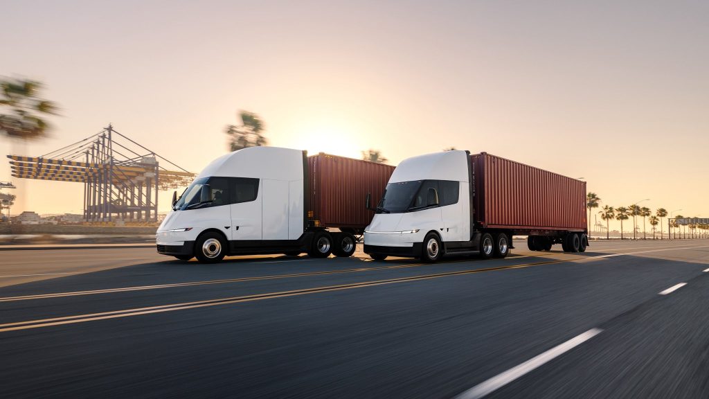 tesla semi driving past pier