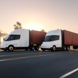 tesla semi driving past pier