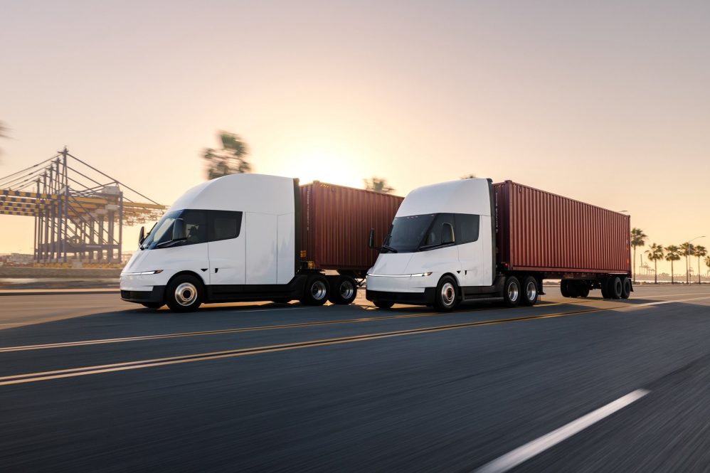 tesla semi driving past pier