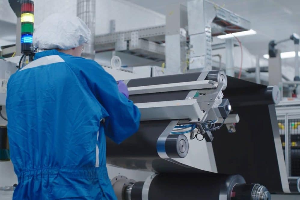 Technician in a clean suit working on battery prototyping at GM's Battery Cell Innovation Center in Warren, Michigan