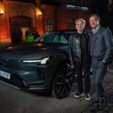 Volvo Cars CEO Håkan Samuelsson and NVIDIA CEO Jensen Huang standing beside a grey Volvo SUV at night