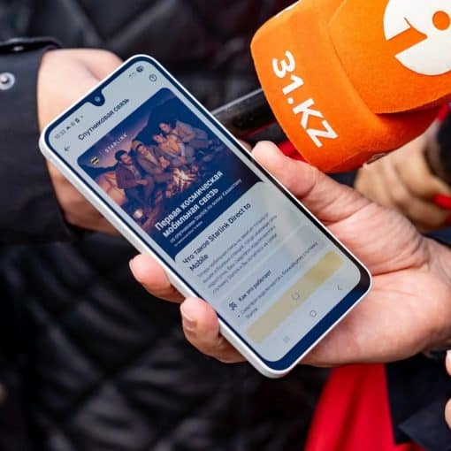 Smartphone showing Beeline Kazakhstan's Starlink satellite-to-mobile service at a launch event