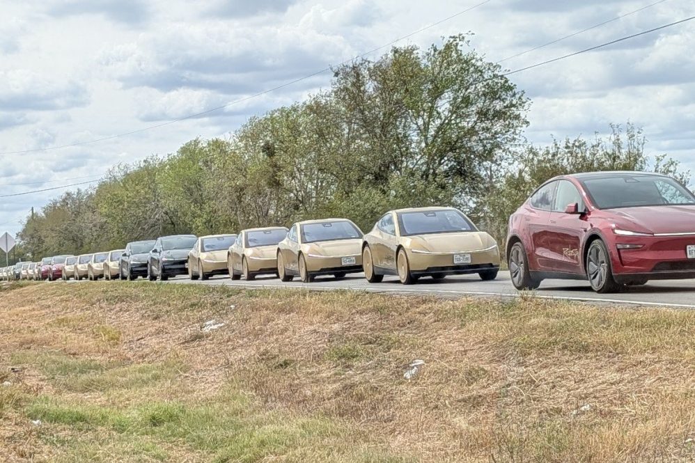 Line of gold Tesla Cybercabs and Model Y Robotaxis in Austin during F1 weekend