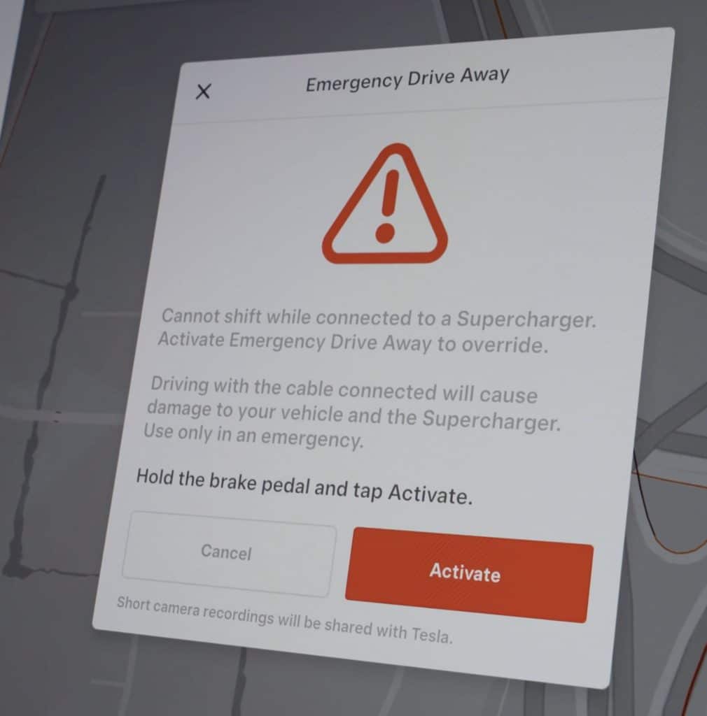 emergency drive away warning prompt on tesla display