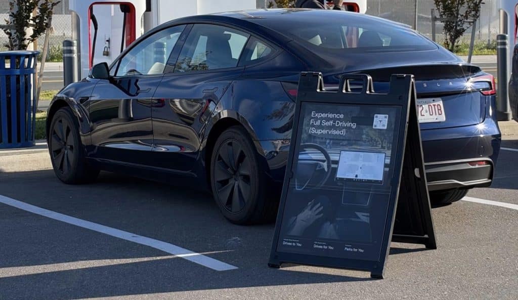 fsd demo drive sign at supercharger in ontario