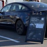 fsd demo drive sign at supercharger in ontario