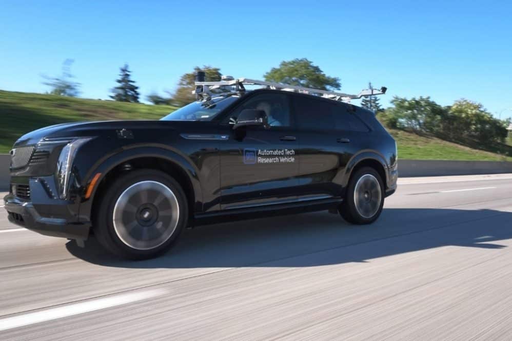 Cadillac Escalade IQ autonomous test vehicle with roof sensors driving on a highway