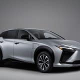 Silver 2027 Lexus RZ 350e in a studio