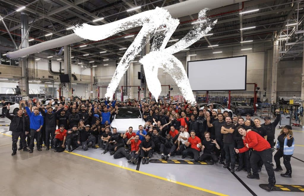 tesla employees celebrating 7000 model y vehicles at giga berlin in one week
