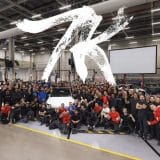 tesla employees celebrating 7000 model y vehicles at giga berlin in one week