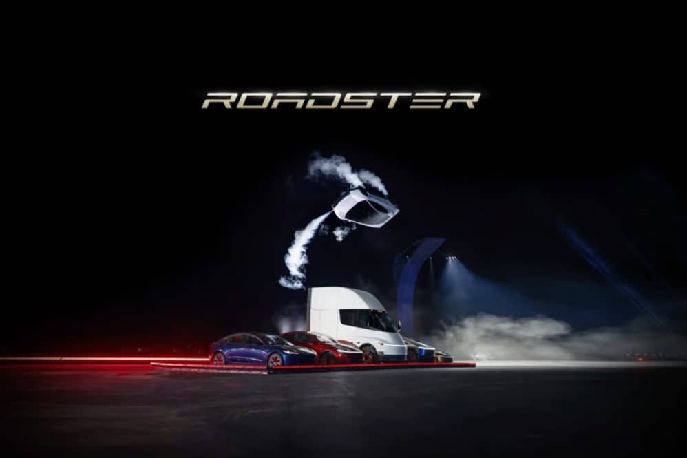 tesla roadster flying over the lineup of vehicles