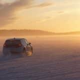 Volkswagen prototype testing on a frozen lake at sunset