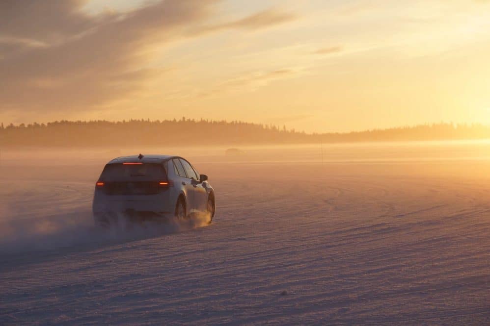 Volkswagen prototype testing on a frozen lake at sunset