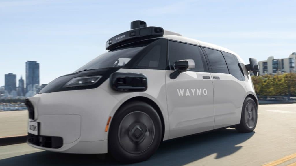 Waymo Ojai robotaxi driving on a city road