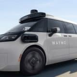 Waymo Ojai robotaxi driving on a city road