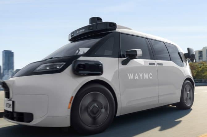 Waymo Ojai robotaxi driving on a city road